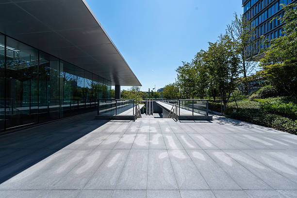 istock modern office building with street in city 2232138657