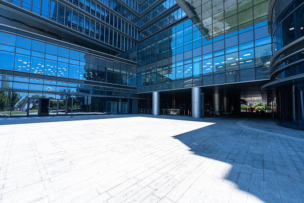 istock modern office building with street in city 2232138728