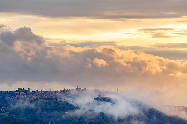 Mountain village with clouds at dusk