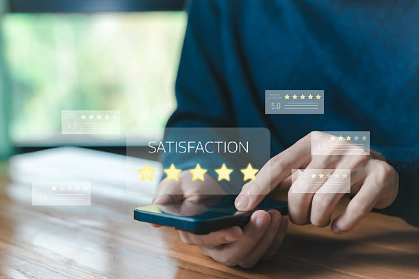 istock Customer satisfaction rating concept. man using smartphone, showing five-star review, feedback, and online evaluation for business service quality and digital customer experience management. 2232141834