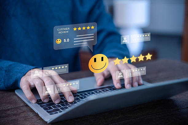 istock Customer feedback concept with five star rating and smiley face on digital screen, businessman typing review on laptop showing satisfaction evaluation, online service quality. review and feedback 2232141835