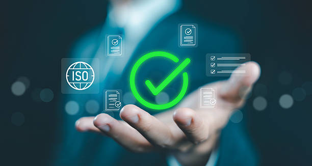 istock ISO certification concept with green checkmark icon floating above hand, symbolizing quality assurance, international standards, compliance, document approval, audit, and process validation. 2232141850