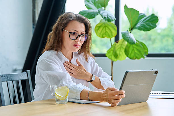 istock Middle aged female teacher entrepreneur using digital tablet for video online meeting 2232143159