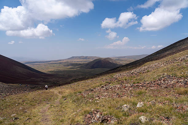 istock Scenic Summer Hike on Volcanic Terrain with Red Mountain in Background 2232143260