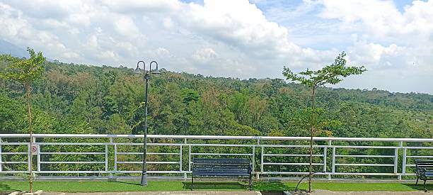 istock green landscape scenery with trees and clouds 2232143578