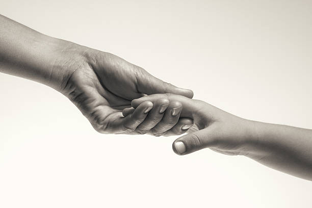 istock A metaphor for caring for and protecting a child. 2232143659