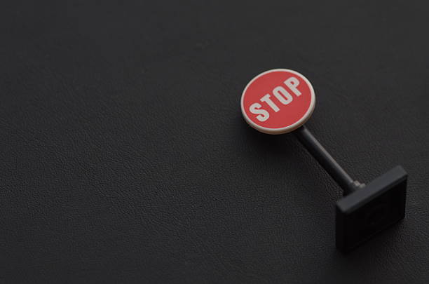 Stop Sign Toy on Light Brown Surface  Safety, Alert, Prohibition Concept