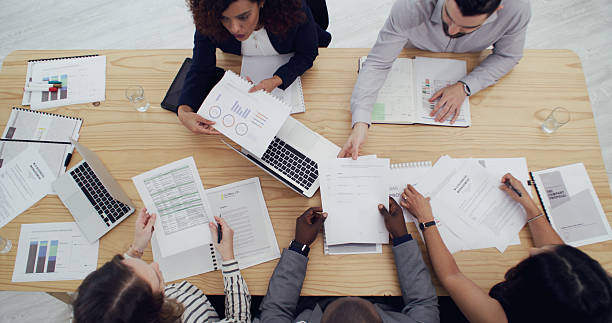 istock Business, people and group with paperwork in office for campaign planning, KPI performance and SEO. Above, teamwork and graph documents for research strategy, analytics report or marketing management 2232146644