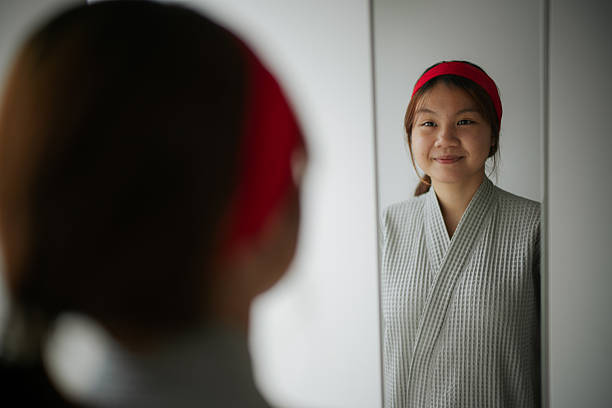 istock Woman looking at herself in the mirror. 2232150805
