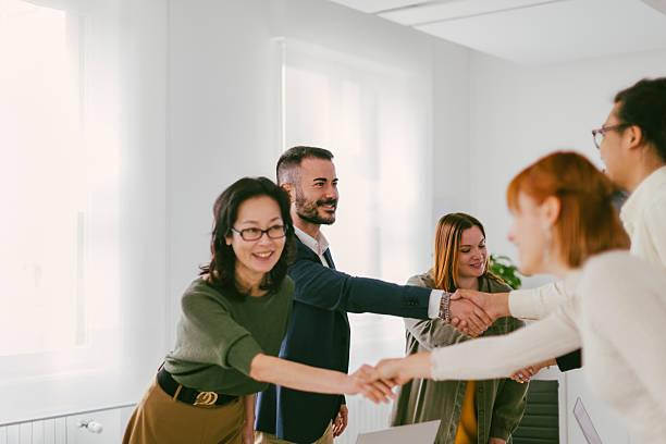 istock Business team shaking hands during meeting in the office 2232150949