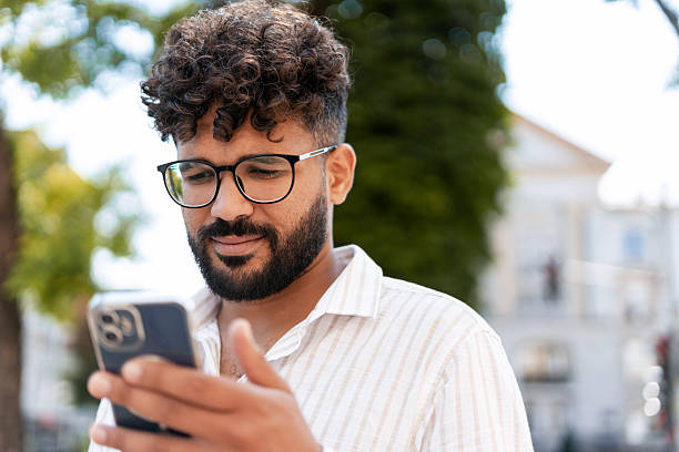 istock Young businessman using smartphone in the city 2232152605