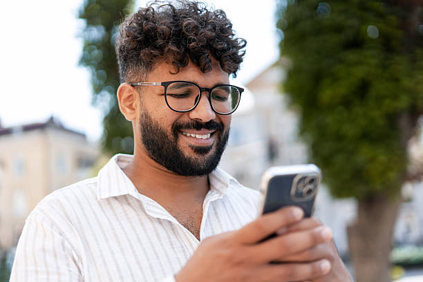 istock Young businessman smiling and using his smartphone outdoor 2232152666