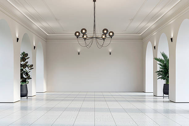 istock Modern empty interior with elegant arched openings, decorative ceiling molding, chandelier and decorative potted plants on white ceramic floor 2232155515