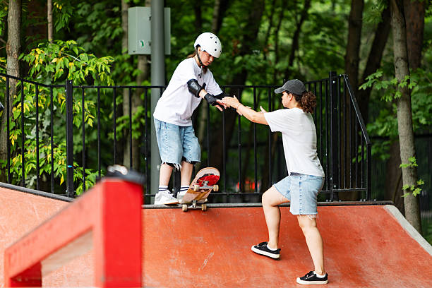 istock Skateboard instructor training girl on sport ramp 2232155736