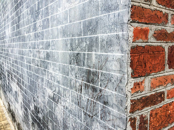 Corner of two brick walls of different colors