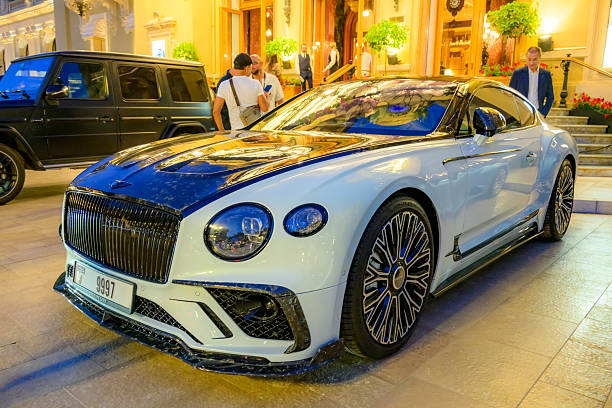 Bentley Continental GT MANSORY coupe parked on the Casino square in Monte Carlo in Monaco during a summer evening. Mansory  luxury car modification firm modified the Continental GT with two-tone paintwork, alternating with front apron, bonnet, side skirts and rear diffuser.