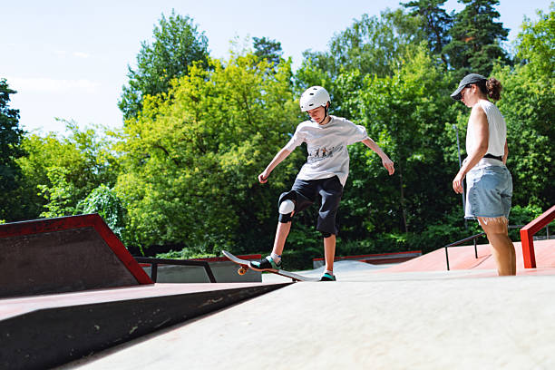 istock Skateboard instructor training boy in sport ramp 2232156108