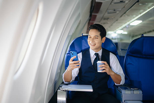 istock Confident businessman making a call in first class, enjoying comfort and connectivity during an international business trip. Ideal for travel, lifestyle, and corporate themes. 2232158650