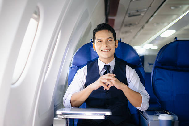 istock Confident businessman sitting in first class, smiling with a relaxed and professional look. Perfect for travel, lifestyle, and corporate success themes. 2232158682