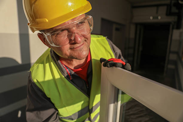 istock Senior Construction Worker Wearing Safety Helmet and Reflective Vest While Installing Window Frame Indoors 2232159598