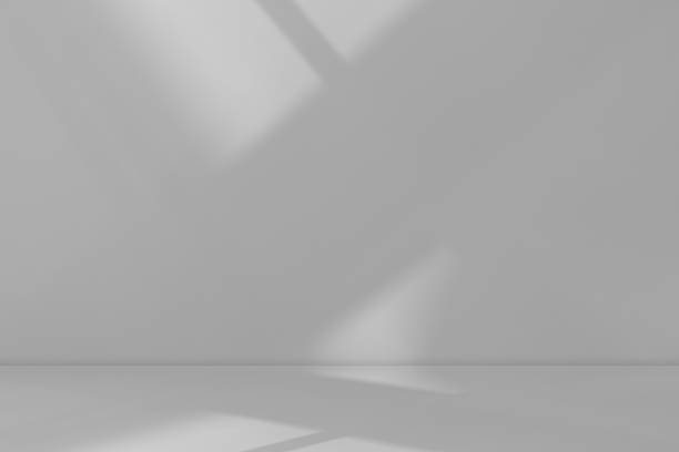 istock Minimal grey studio background with soft white sunlight,shadows on wall and floor,Interior room design for product mockup,presentation,website banner modern clean design backdrop for creative projects 2232162598