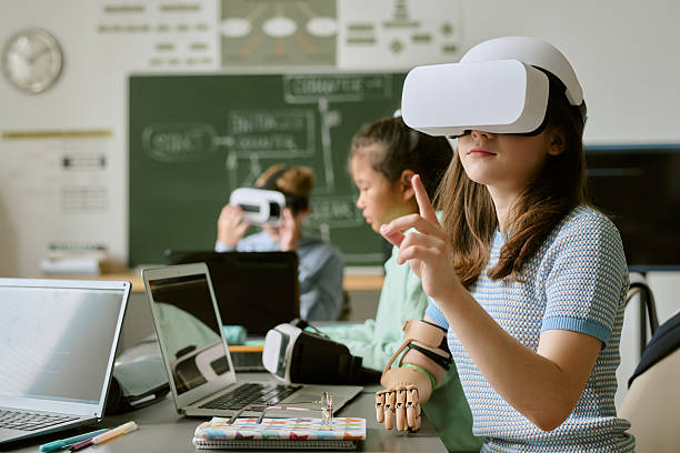 istock Caucasian Teen Girl Using Virtual Reality Headset in Classroom Setting 2232163256