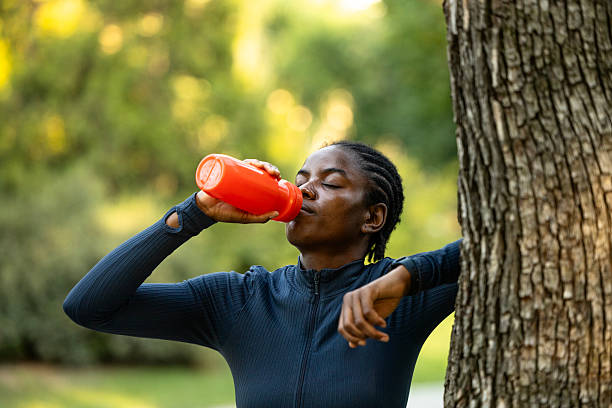 istock Highly motivated female athlete drinking water on training. 2232163327