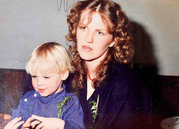 istock Staring Young Mother eiyh her Son, back in the Seveties. 2232163602