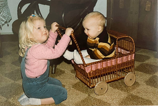 istock Playing siblingToddlers back in the 1980's. 2232163612
