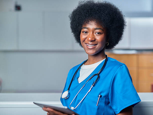 istock Smiling Medical Professional in Clinic Reception with Stethoscope in Uniform 2232164419