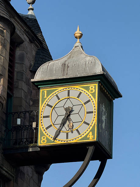 istock Broken clock hanging from building in edinburgh scotland 2232165927