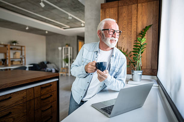 istock Senior man enjoying a coffee break while working from home 2232166496