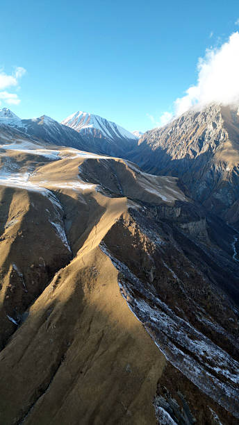 Caucasus Mountains Radiating Sunlight and Majestic Charm