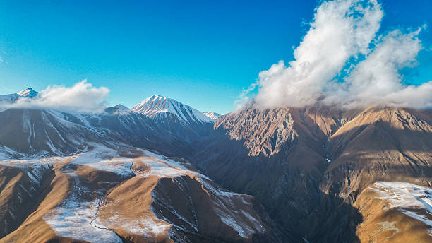 Caucasus Mountains Radiating Sunlight and Majestic Charm