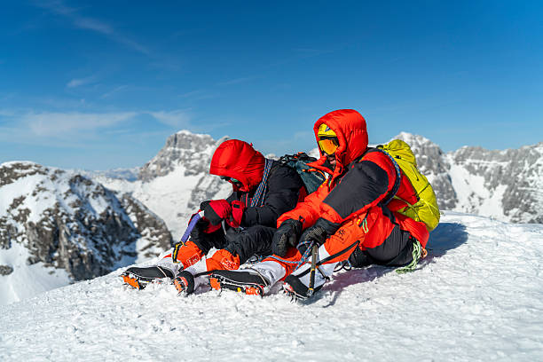 A man holding the ice climbing crampons