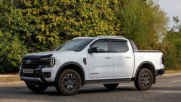 Whittlebury,Norhants,UK - Aug 23rd 2025:  2024 white Ford Ranger pick up truck driving on a British road