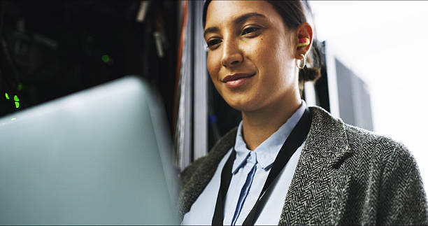 istock Server room, laptop and happy woman technician for cybersecurity update or online machine system. IT support, data center and smile of engineer for network, information technology and solution 2232174285