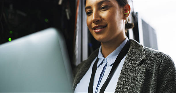 istock Cybersecurity, testing or woman on laptop for engineering, repair or inspection in server room. Information technology, programming or IT technician with data for maintenance, backup or control panel 2232174288