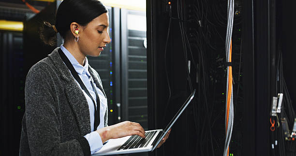 istock Inspection, database and woman with laptop in control room for technical support in office. Computer, maintenance and IT consultant at board system for checking cybersecurity server in workplace. 2232174302