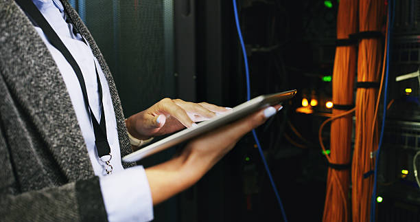 istock Hands, woman and engineer on tablet in server room for diagnostics, update system and backup. Programmer, digital and IT inspection of technical engineering, network security and hardware maintenance 2232174315