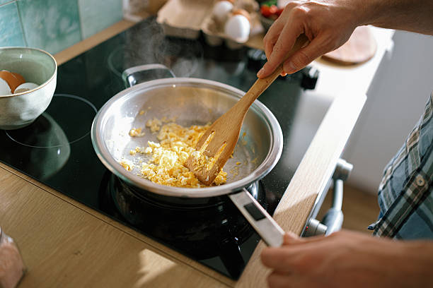 istock Man preparing healthy breakfast omelette in skillet 2232176848