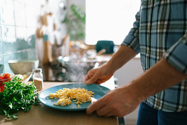 istock Man holding plate with steaming omelette 2232176866