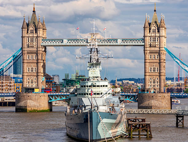 istock Tower bridge and Belfast warship on Thames river, London, UK 2232177444