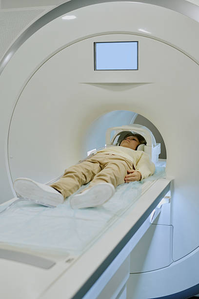 istock Child Lying Inside Mri Scanner Undergoing Medical Imaging Procedure 2232177849