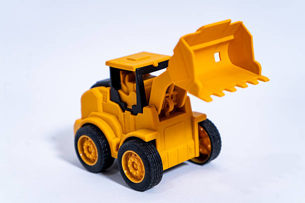 istock Yellow toy bulldozer excavator ready for construction works 2232181673