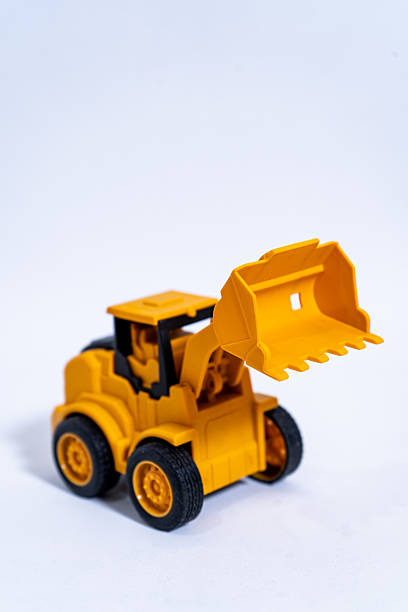istock Yellow toy excavator ready for construction playtime 2232181732