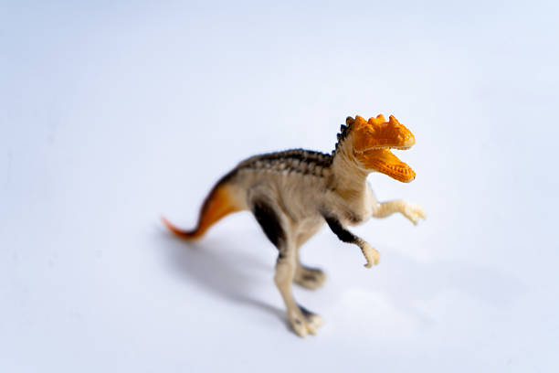 istock Plastic dinosaur toy roaring on white background 2232182334