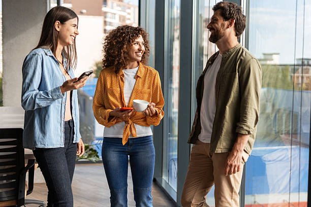 istock Coworkers chatting during a coffee break in the office 2232183826