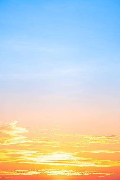 istock Beautiful , luxury soft gradient orange gold clouds and sunlight on the blue sky perfect for the background, take in evening,Twilight, Large size, high definition landscape photo,Vertical 2232185487