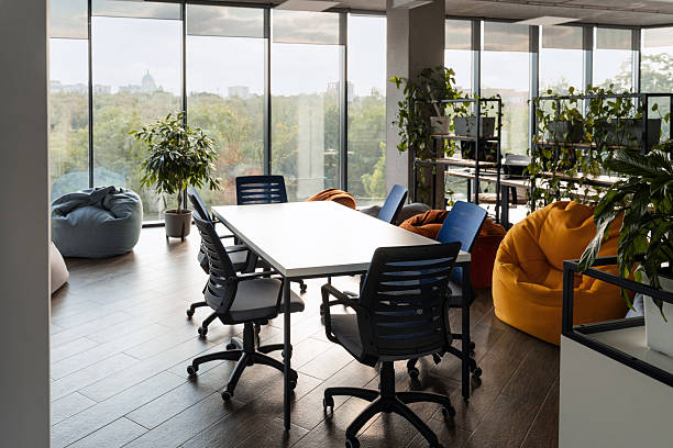 istock Modern coworking space with meeting table and beanbag chairs 2232187063